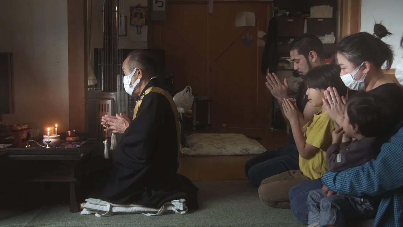 Ainu family prays in AINU PURI