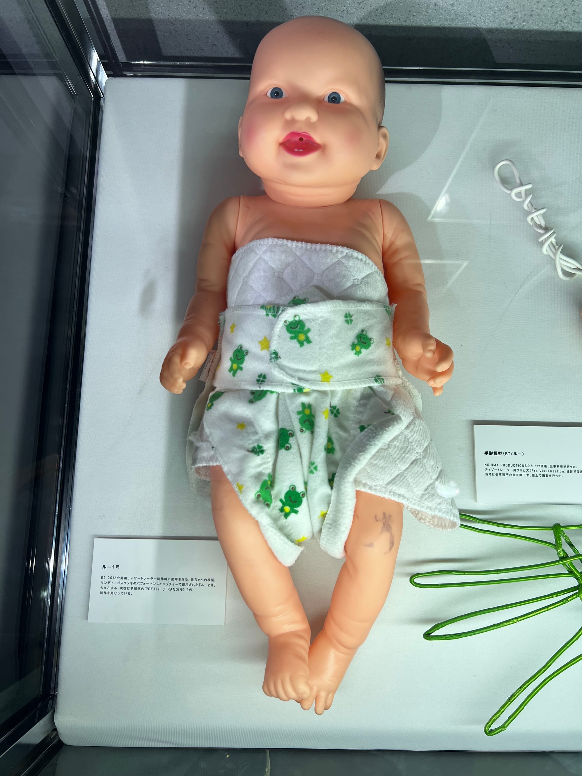 Baby doll stand-in on display at the PARCO Death Stranding exhibition