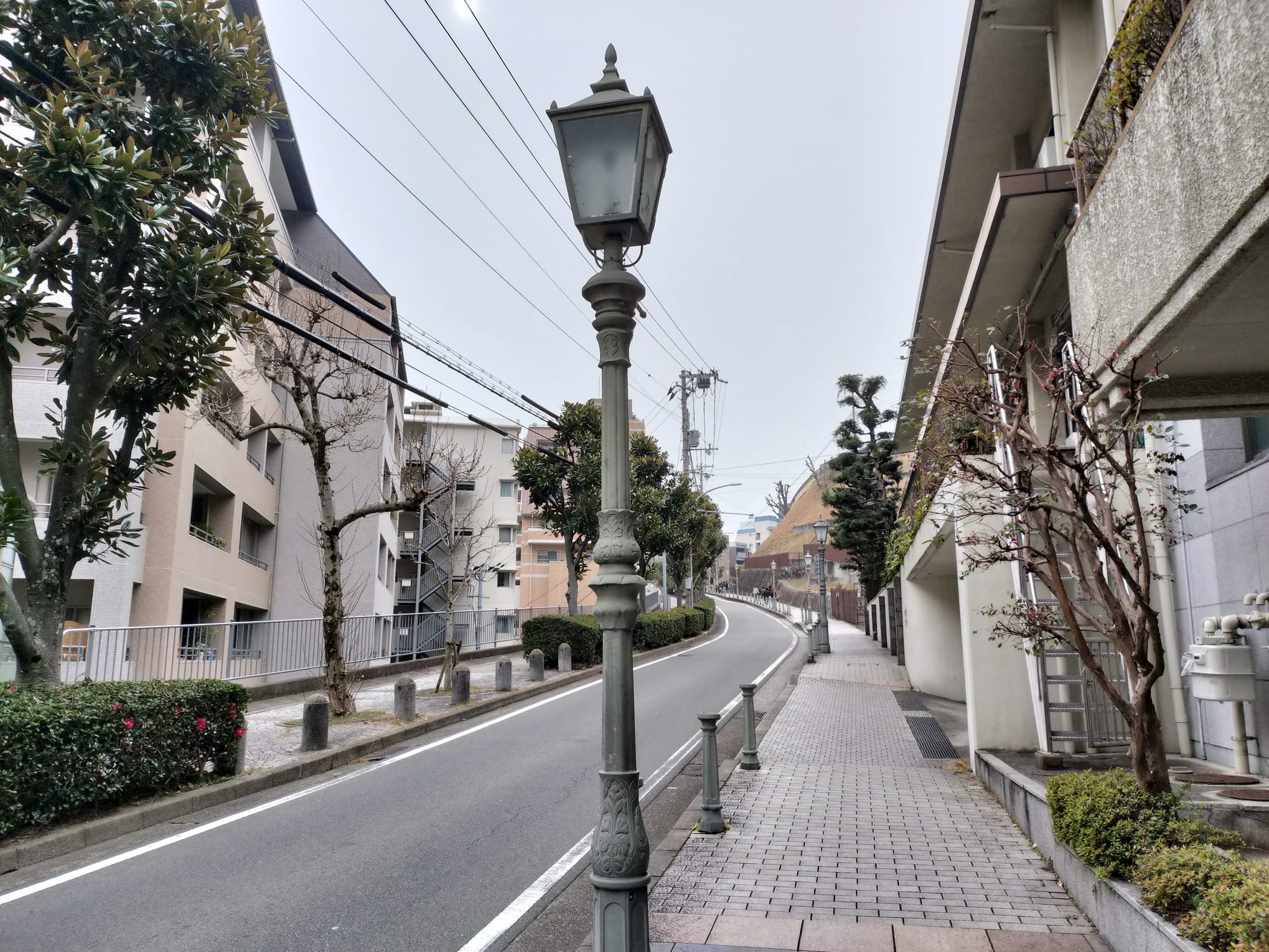 A spot along Kitano dori lined with western-style street lamps, also used as a background reference in the original visual novel.