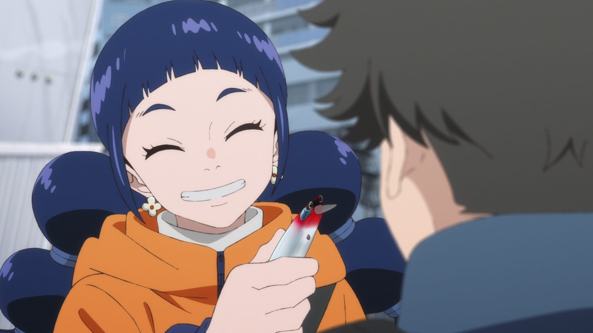 A smiling Hana shows Tsunehiro a fishing lure. 