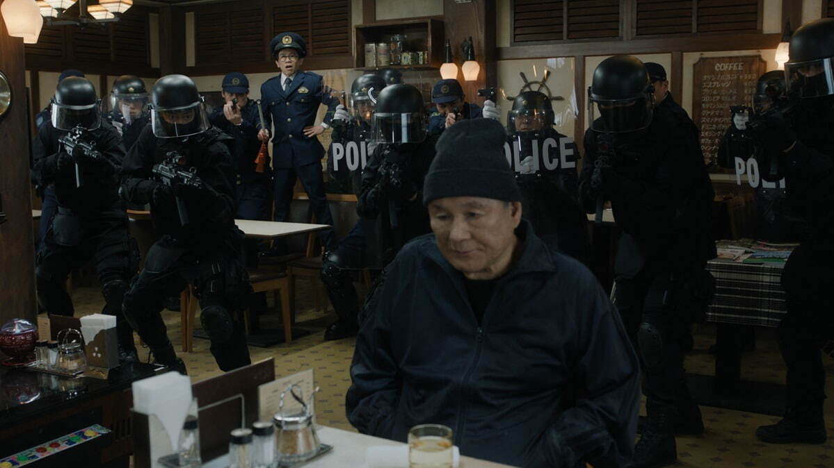 Takeshi Kitano surrounded by police in Broken Rage