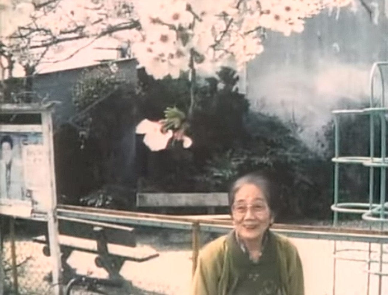 Uno Kawase smiling in front of a small park