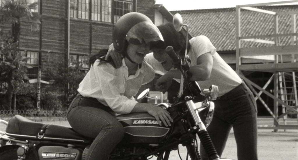 Miyako and Ko with his Kawasaki in His Motobike, Her Island
