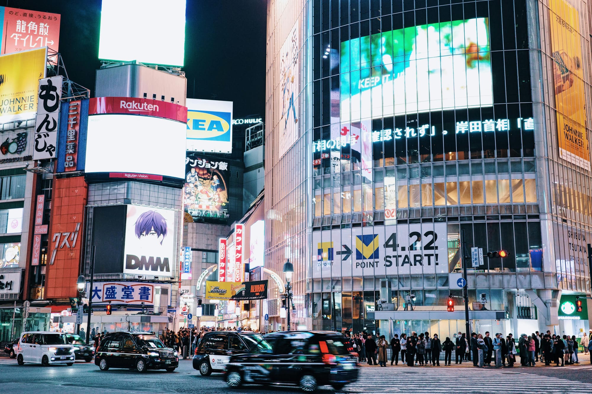 Crowded Shibuya Scramble crossing at night