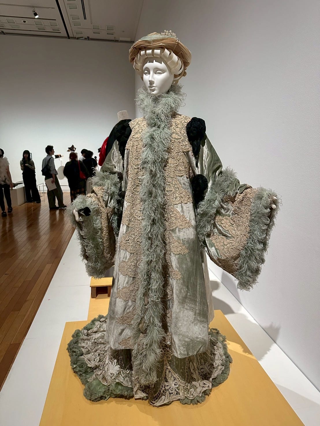 A circa 1900 floor length jacket from the Houe of Worth featuring ostrich feathers