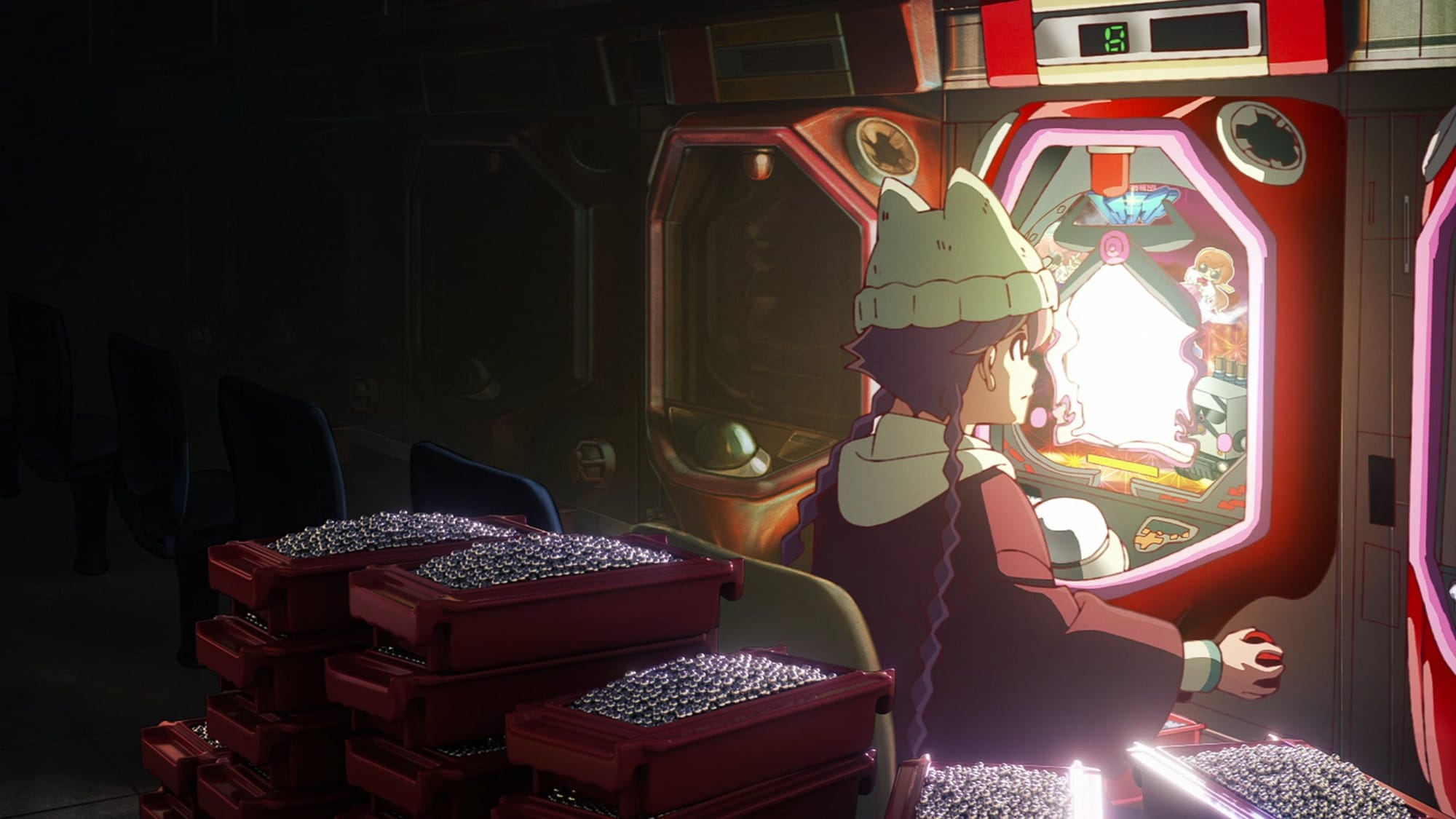 Yachiyo sits at a pachinko machine surrounded by many metal balls.