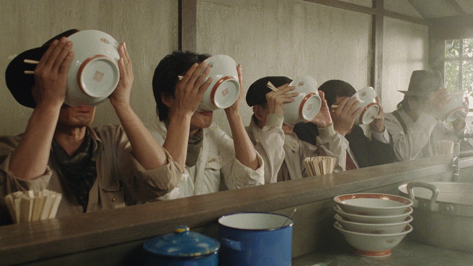 Goro and friends finish and drink the broth from their ramen bowls.