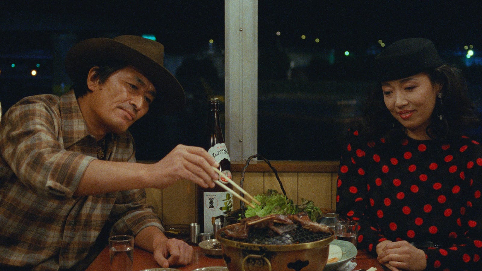 Tampopo characters Goro (left) and Tampopo (right) enjoying a nighttime meal.