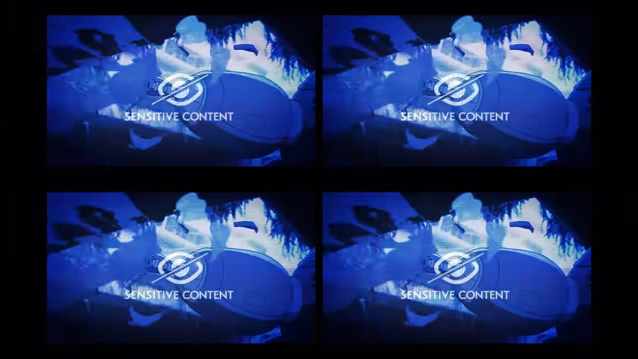 Four images of a fuchikoma shooting its guns, marked "Suggestive Content."