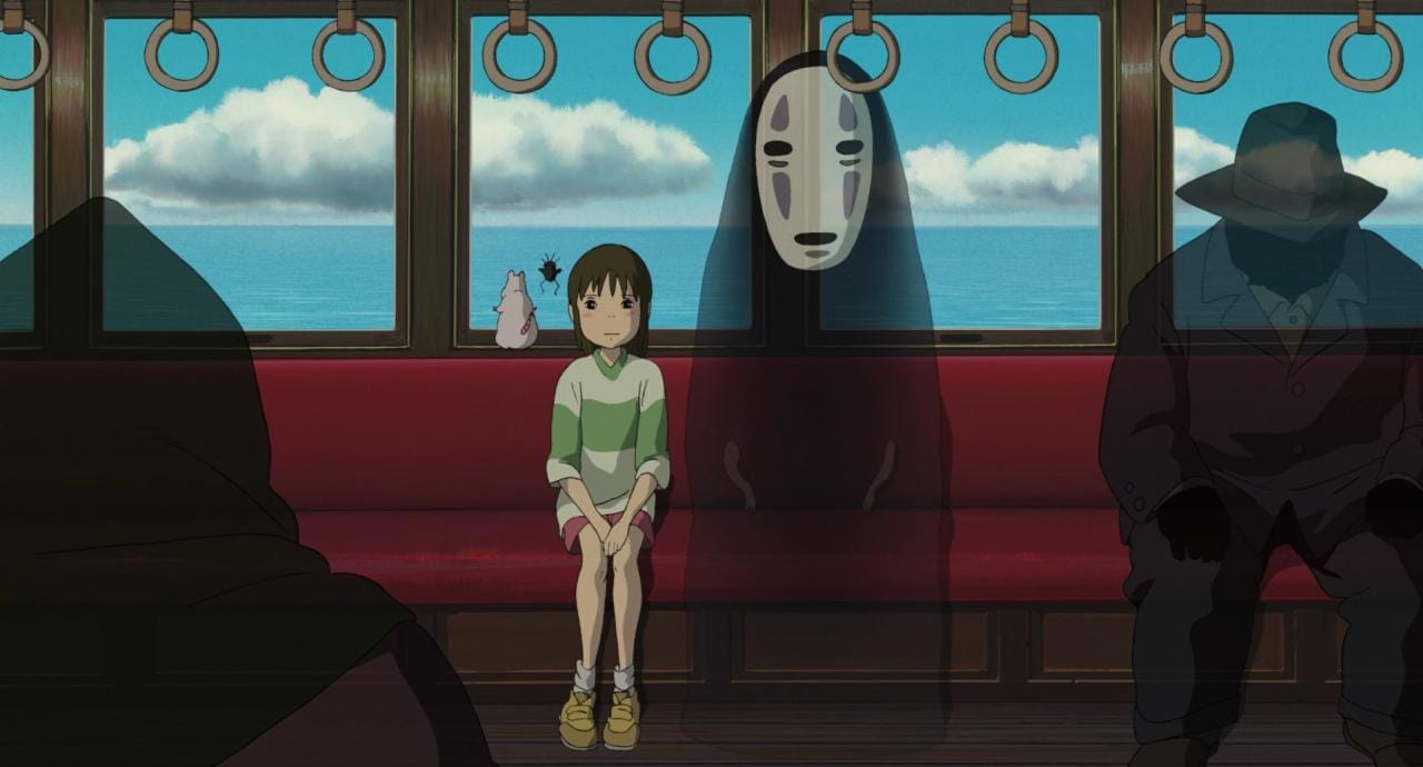 spirited away chihiro, no face, mouse, and fly sit on the train with shadowy passengers.